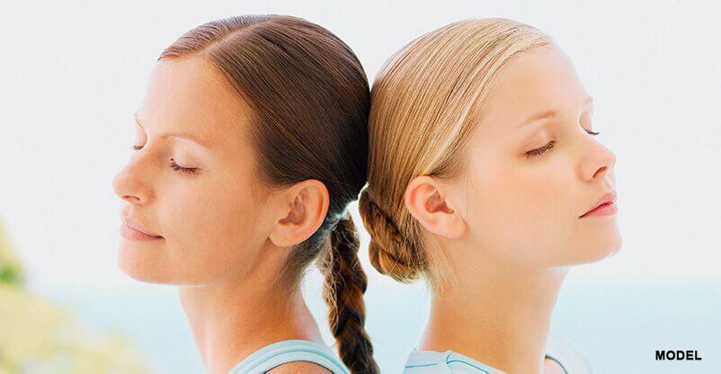 two women models necks with no signs of aging