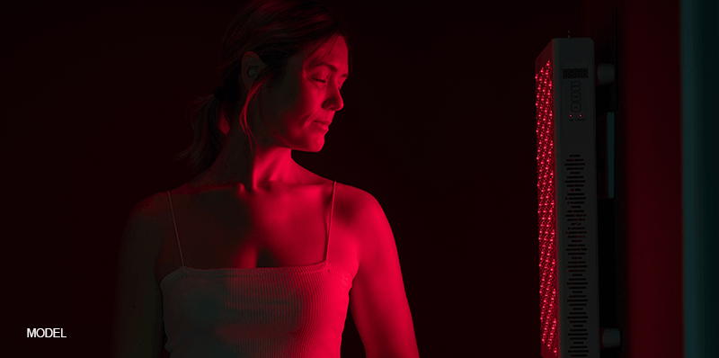 woman receiving professional red light therapy treatment for both face and body