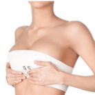 woman post breast augmentation surgery in compression