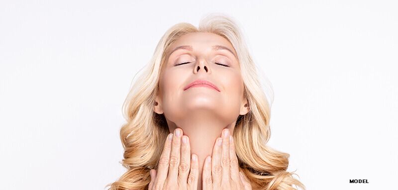 woman model touching smooth neck