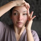 example of woman performing face yoga