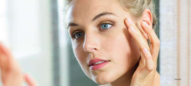 woman applying copper peptide product