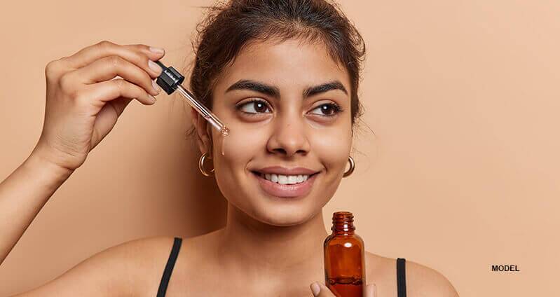 woman showing volufiline containing product