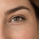 Thumbnail close up of full and well shaped eyebrows