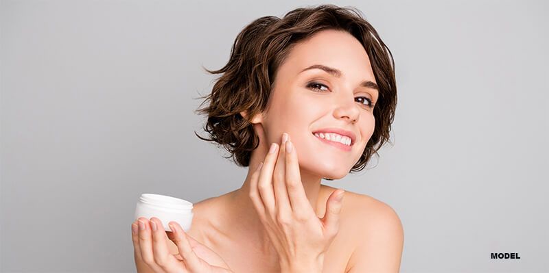 woman applying growth factors